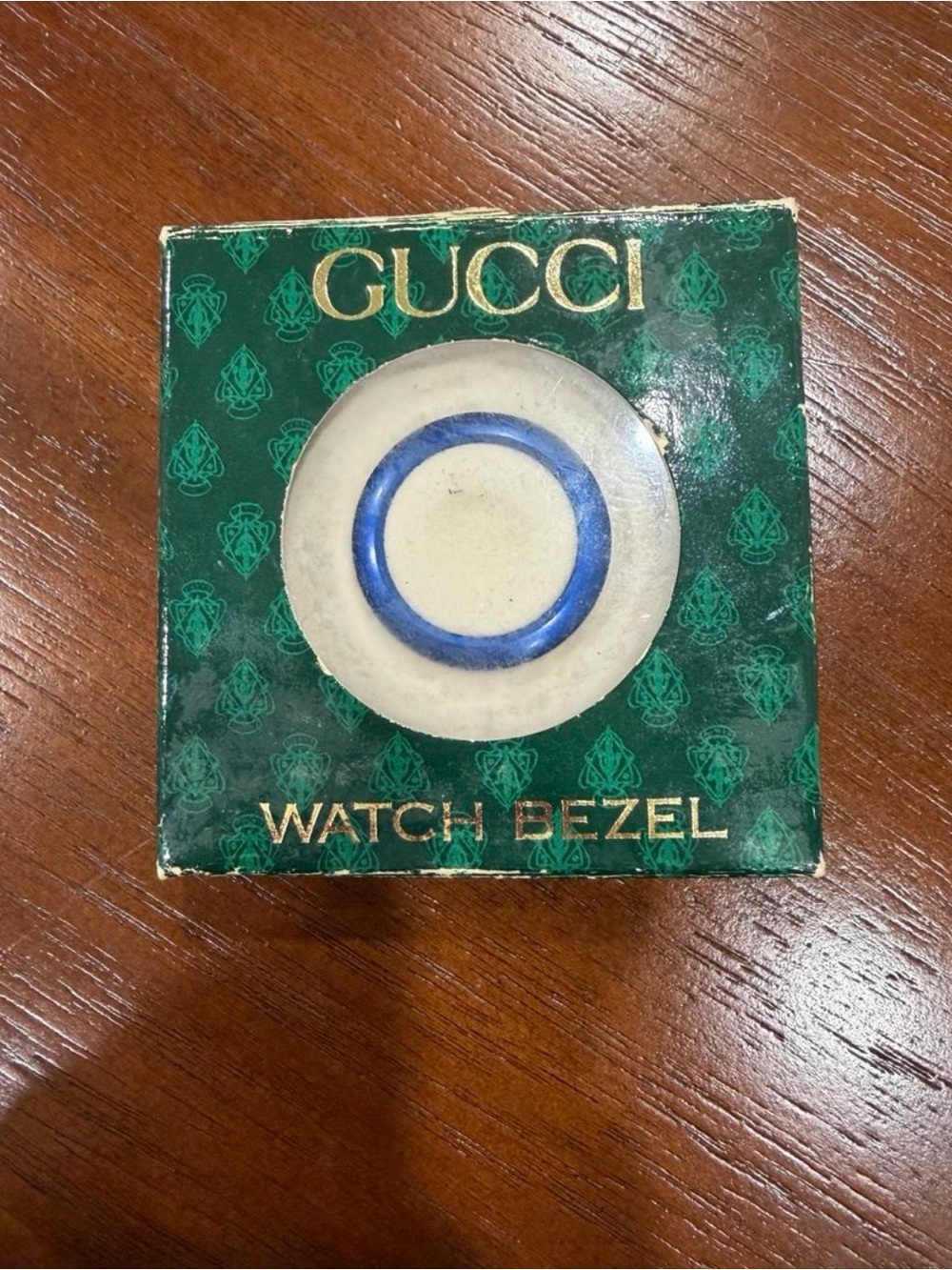 Gucci blue metal bezel